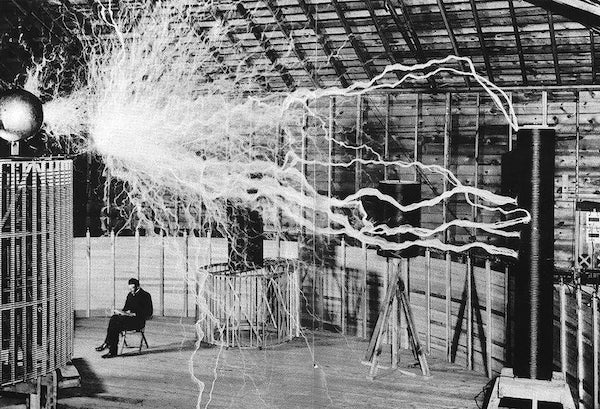Nikola Tesla in his Colorado Springs lab, 1899 - Postcard