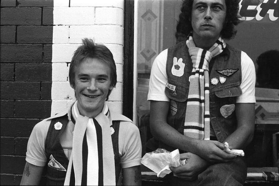 Two Man City Fans - One Eating a Sandwich by Iain SP Reid - c. 1976