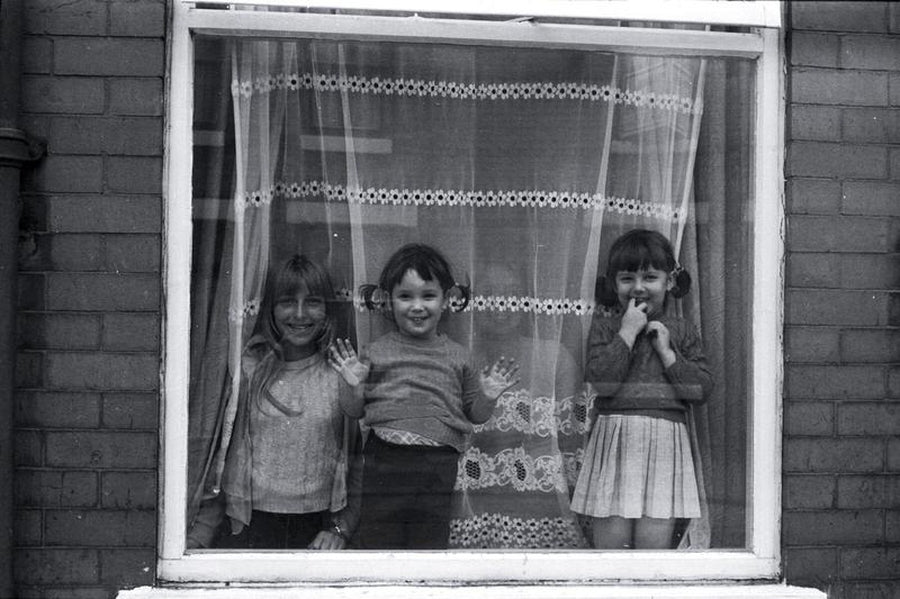 Three Children in A Window in Manchester (2) by Iain SP Reid - c. 1977