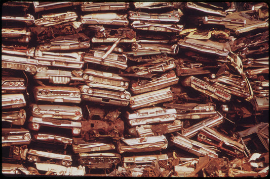 Stacked Cars In City Junkyard Will Be Used For Scrap by Dick Swanson - August 1973