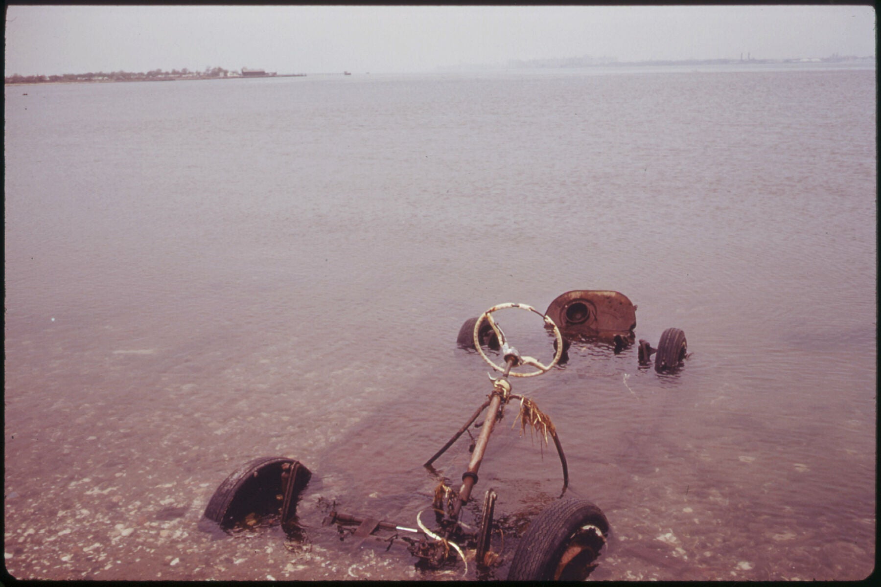 Auto Chassis Submerged in Jamaica Bay Waters near Breezy Point by Arthur Tress - 1973