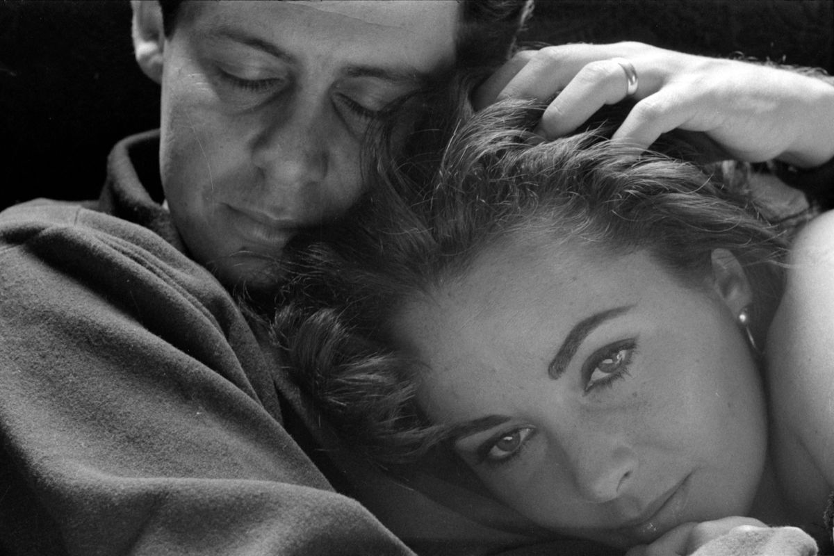 Elizabeth Taylor with her head on her husband Eddie Fisher in 1958 by Toni Frissell.