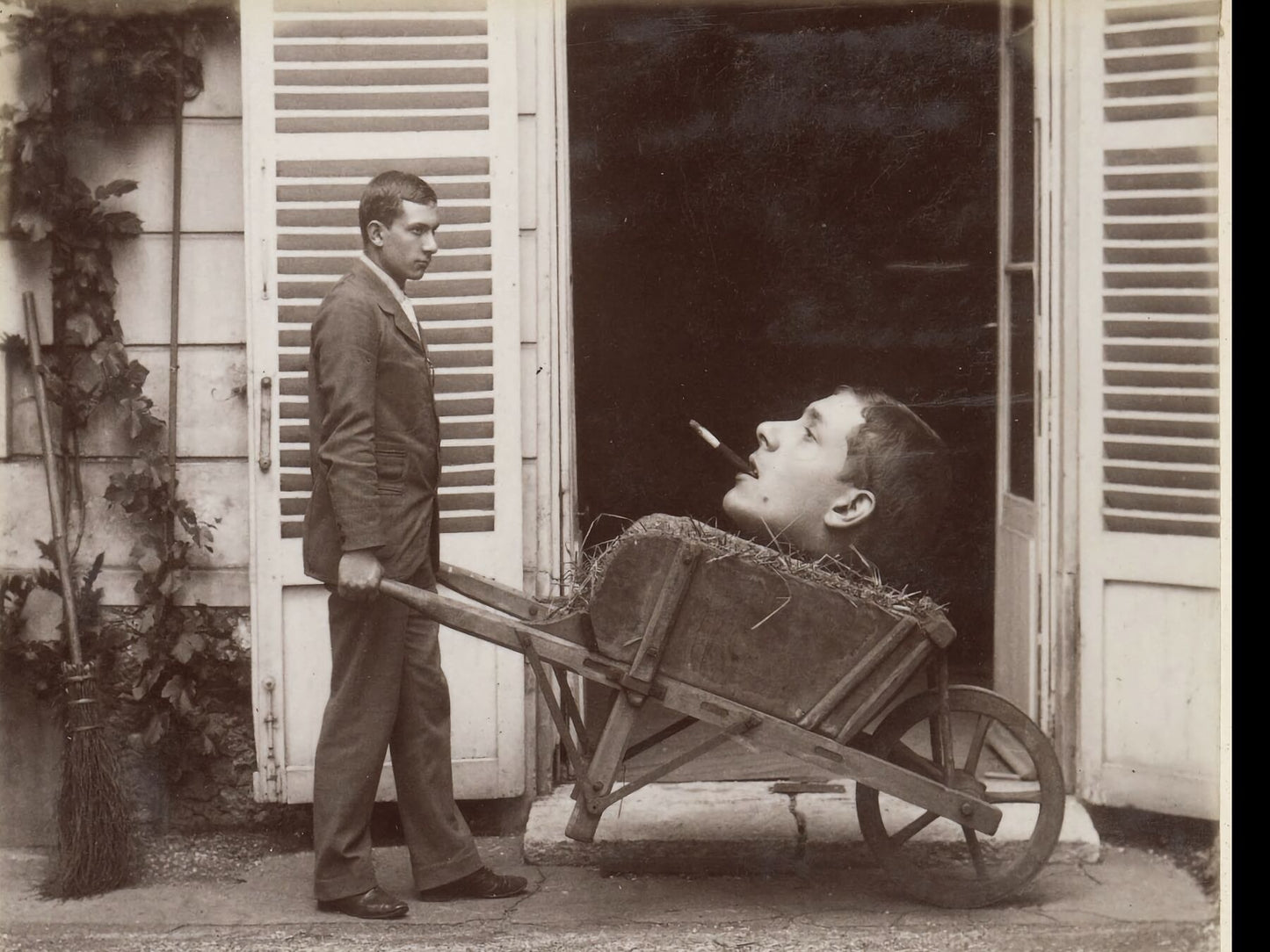 Man Carries (Mounted) Head on Wheelbarrow - c. 1910