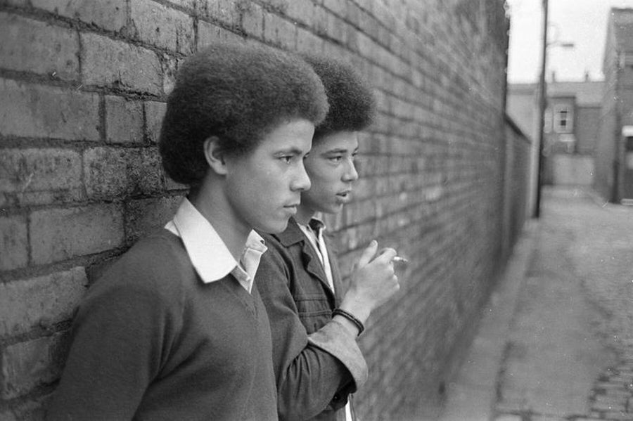 Two Smokers in Manchester, England by Iain SP Reid - c. 1976