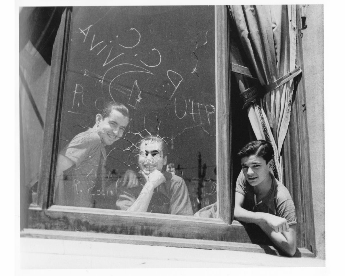 Man with child in Militia Dress, Barcelona by Gerda Taro - August 1936