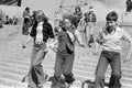 Three Manchester City Fans Running Down the Terraces by Iain SP Reid - c. 1976