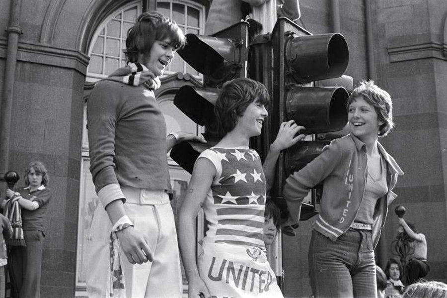 Three MU Fans at a Traffic light by Iain SP Reid - c. 1977