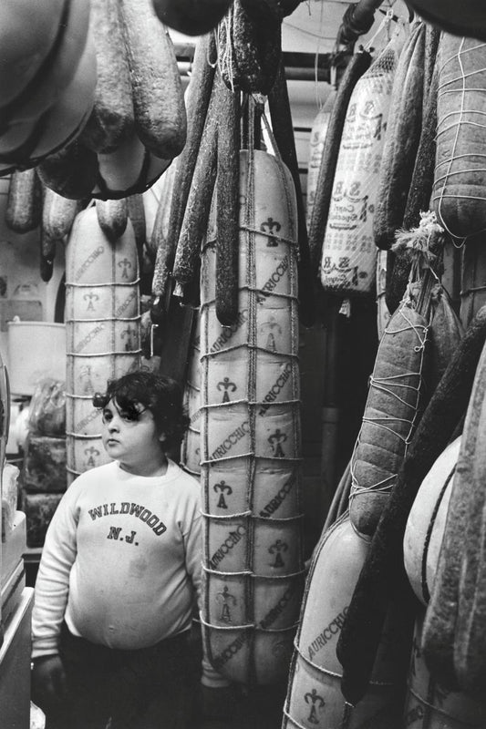 Boy in Italian Grocery Store, Philadelphia by Michael Carlebach - 1973