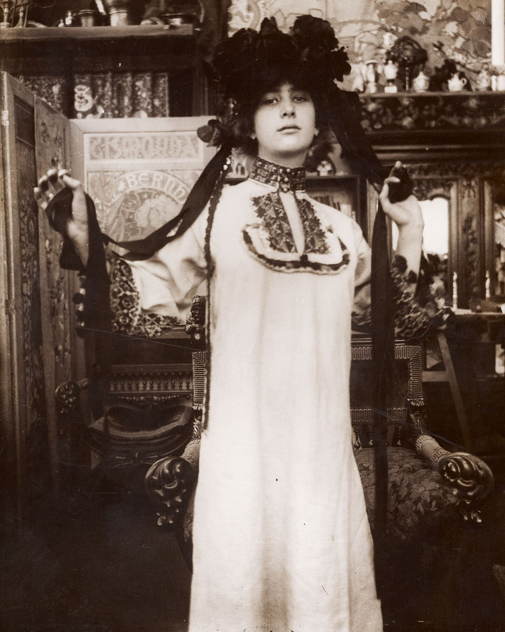 Female Model in a Long White Robe and a Hat with Ribbons, Paris by Alphonse Maria Mucha - 1899