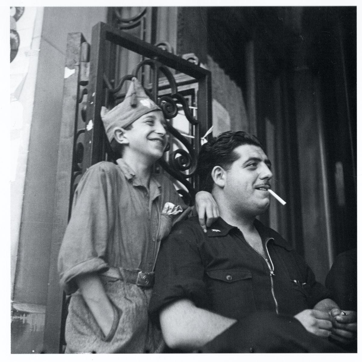 Man with child in Militia Dress, Barcelona by Gerda Taro - August 1936