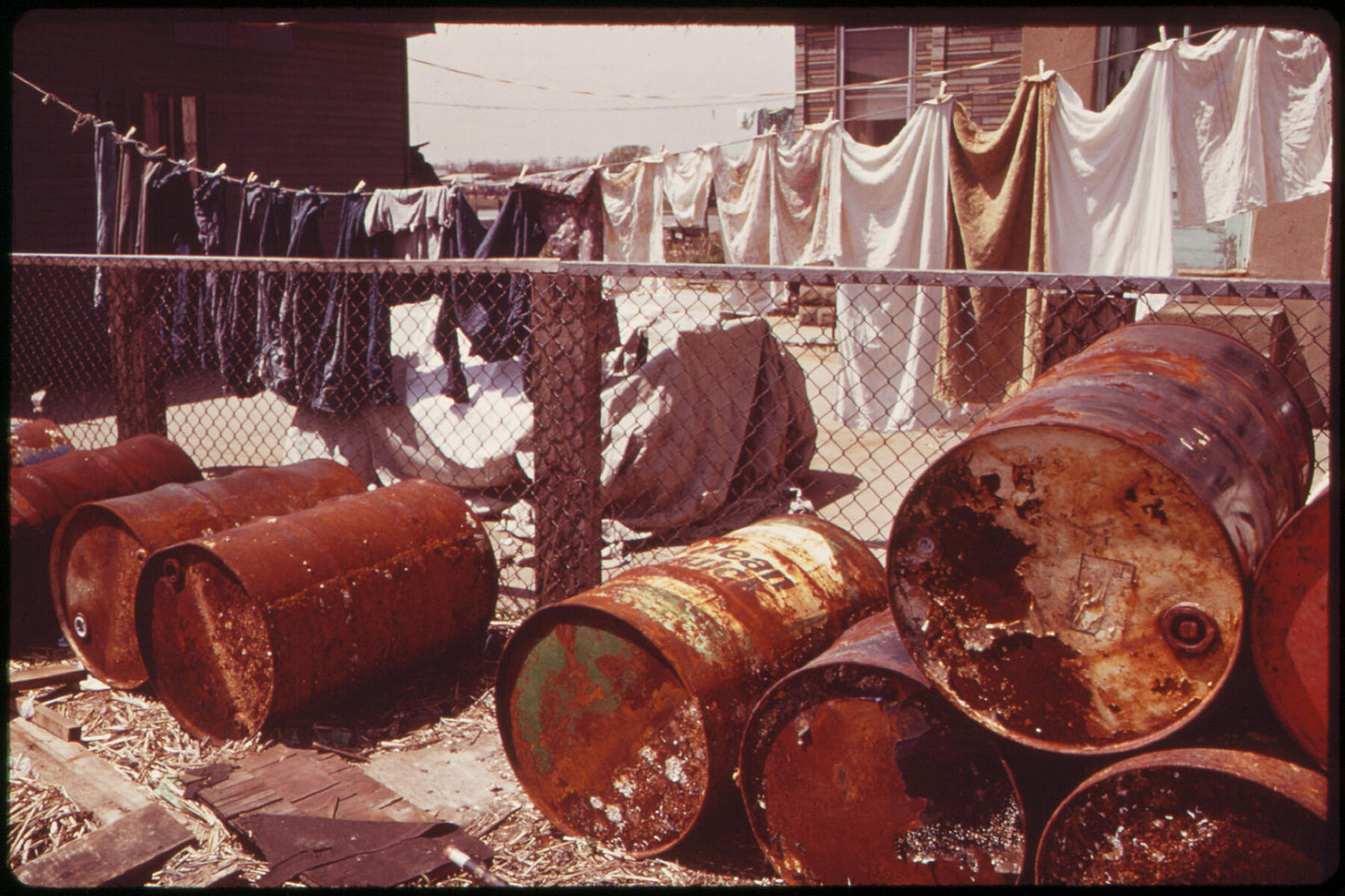 Rusty Oil Cans Pile Up near Home in Broad Channel, a Jamaica Bay Community by Arthur Tress - 1973