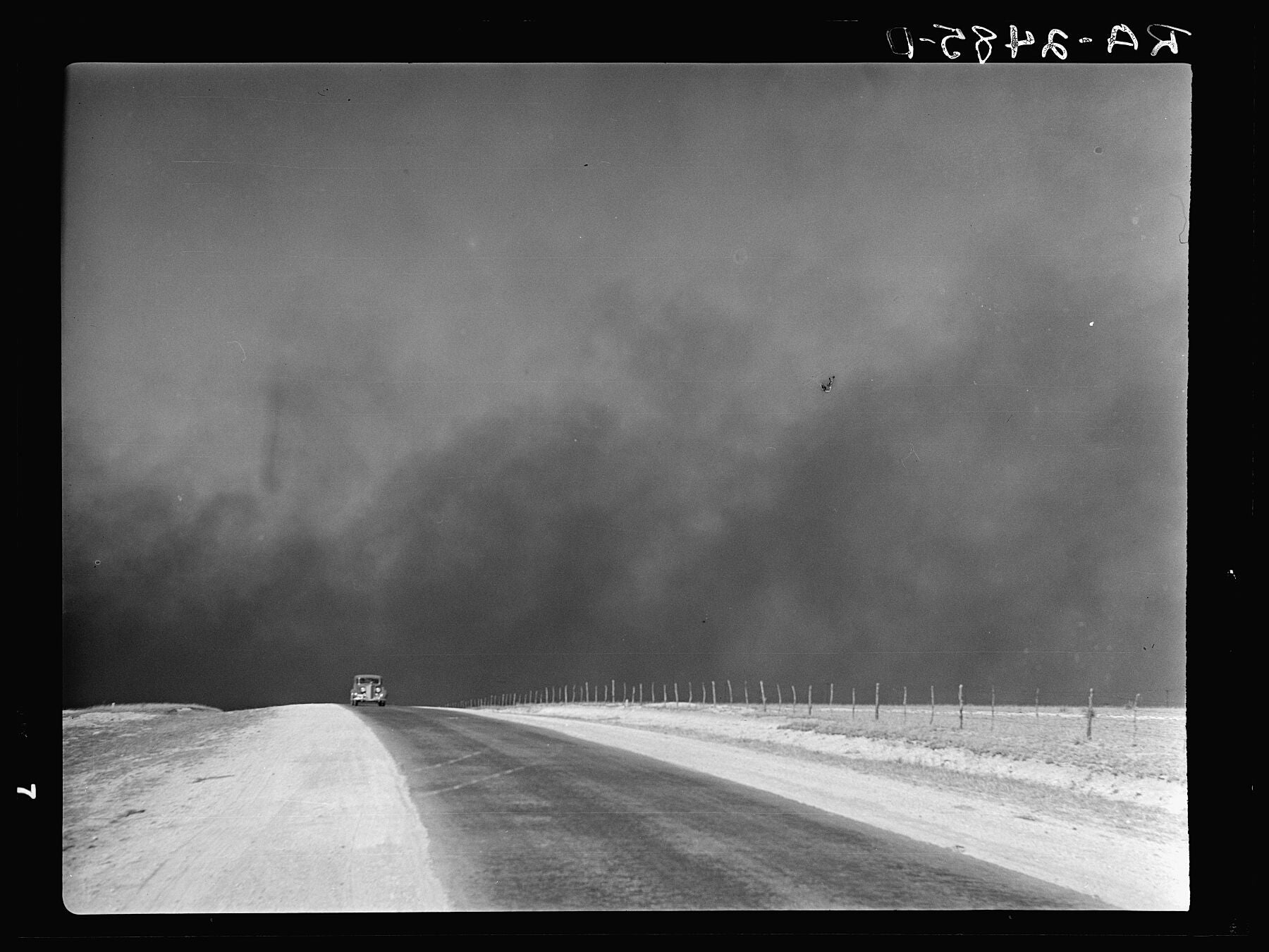 Heavy Black Clouds of Dust Rising over the Texas Panhandle, by Arthur Rothstein - 1936