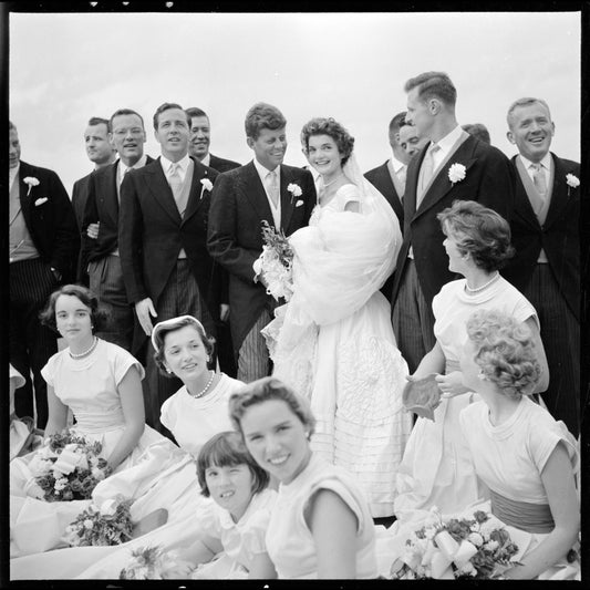 Jackie Bouvier Kennedy and John F. Kennedy, in wedding attire, with members of the wedding party - Sept 12 1953 - by Toni Frissell
