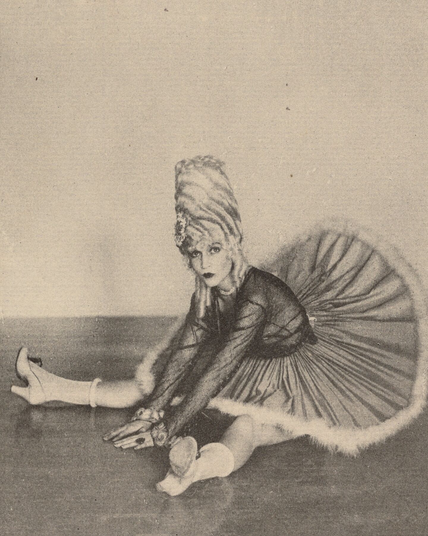 Woman in Can Can Costume Seated on Floor with Legs Spread Apart by Arthur F. Kales - c.1920