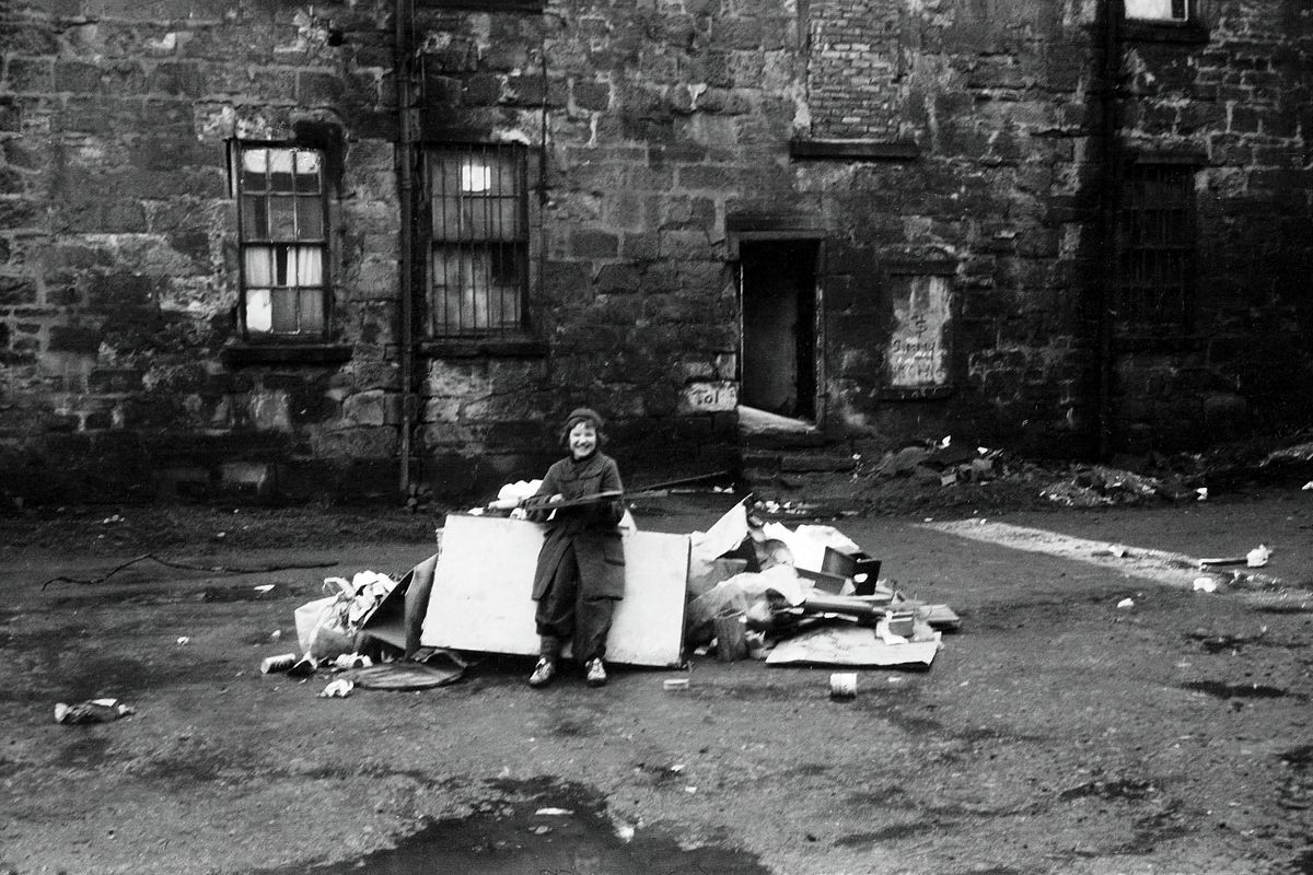 Children playing at a Glasgow tenement in 1975 by John J Brady.