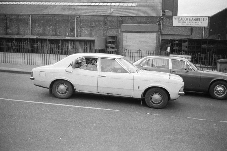Football Supporters in Car by Iain SP Reid . c. 1976
