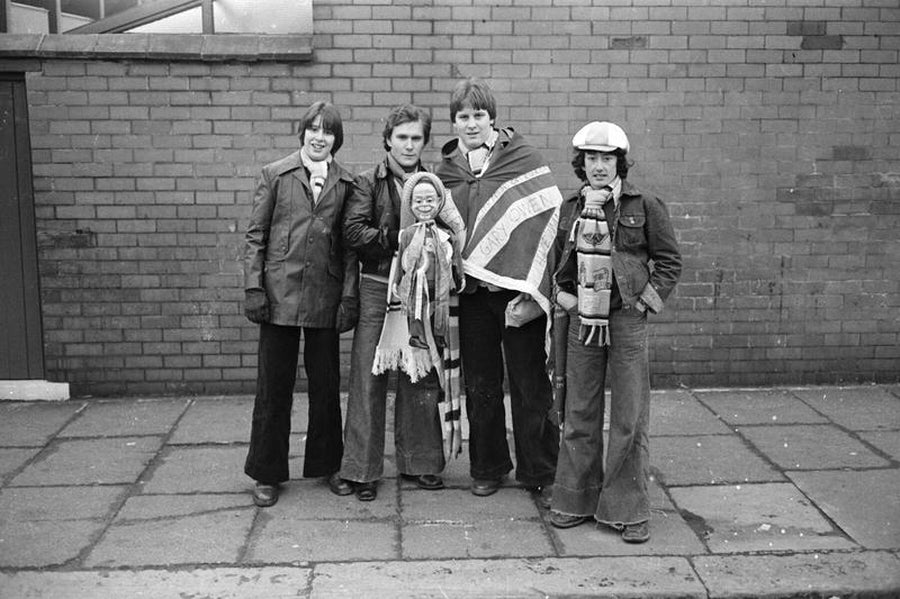 Four City fans with ventriloquist doll by Iain SP Reid.