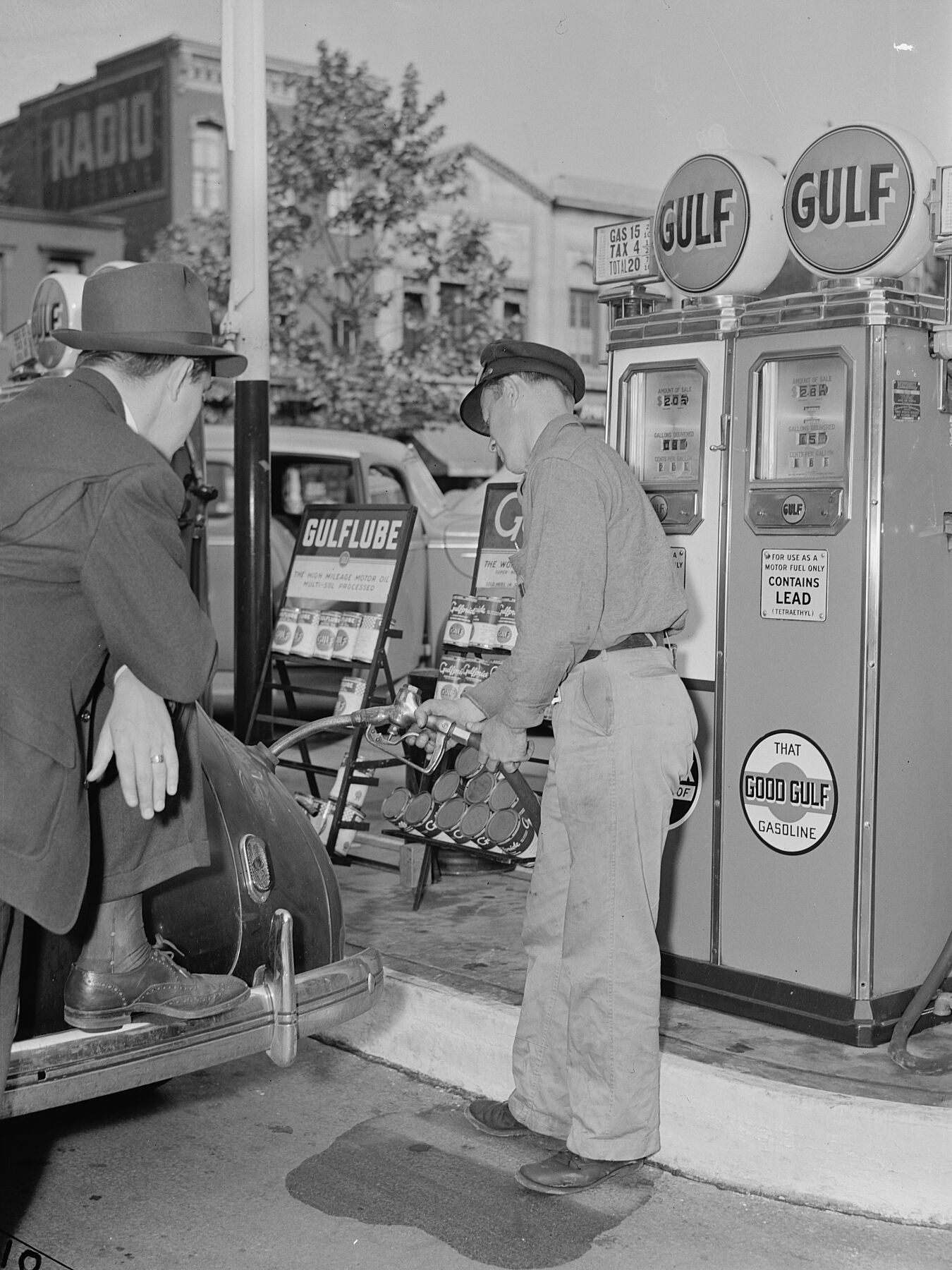 Gas Station Attendant Filling a Dodge i. Washington, D.C by Albert Freeman - 1942 