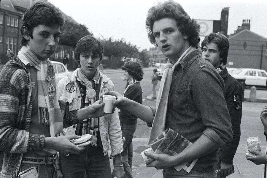 Manchester City Fans Sharing a Drink by Iain SP Reid - c. 1976
